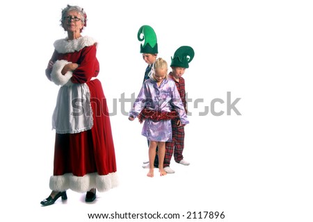 Mrs. Santa tying up her elves in a Christmas garland after catching them breaking the rules