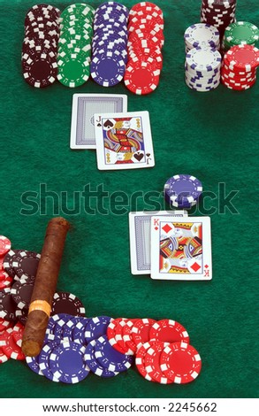 A hand of blackjack in progress with face cards showing all around