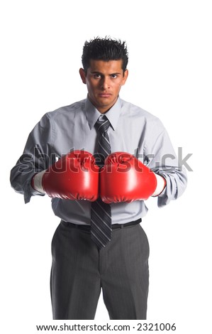 Young Hispanic business man in boxing gloves ready to knock out the deals