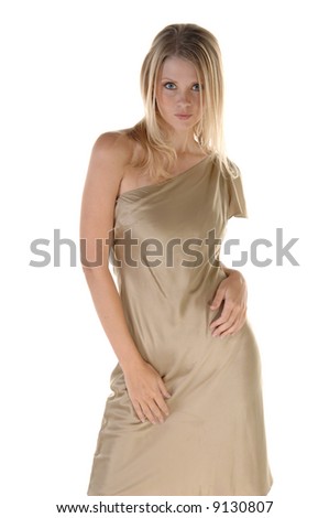 Gorgeous young blonde fashion model in a gold silk evening gown with fierce blue eyes