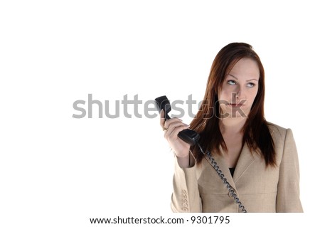 Young female executive making a goofy face at the phone