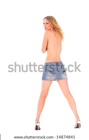 Back view of a topless blond woman wearing a short denim skirt, and high heels.