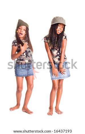 Two little African American girls dressed in denim skirts and military woodland camouflage tops and caps with something to say