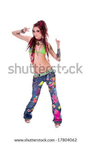 stock photo : Heavily tattooed young hippie woman in retro patchwork jeans 