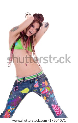 stock photo : Heavily tattooed young hippie woman in retro patchwork jeans