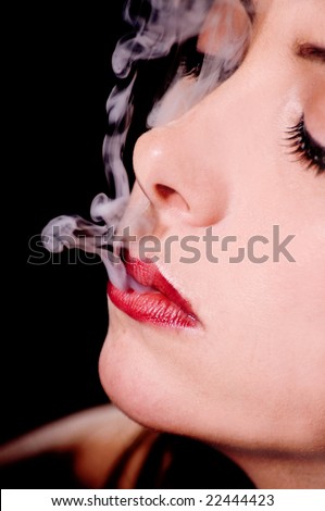 Portrait of a young woman French Inhaling cigarette smoke