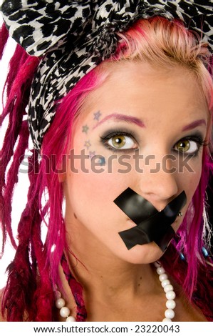 Beautiful young woman with pink dreadlocks and an x of tape over her mouth