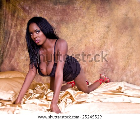 stock photo Sexy African American woman with very large breasts looking 