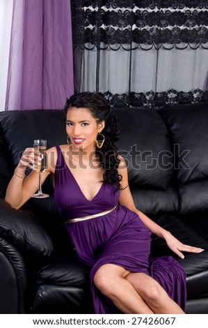Beautiful young asian woman in a purple cocktail dress at a party