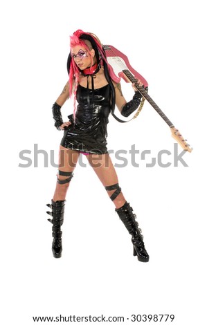 Sexy punk rock diva with her bass guitar over her shoulder