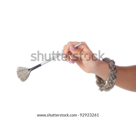 Makeup artist holding the tools of her trade
