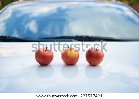 Beautifully arranged apples on a car hood
