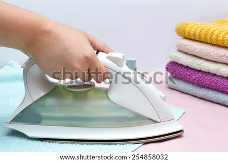 Ironing with a hot iron