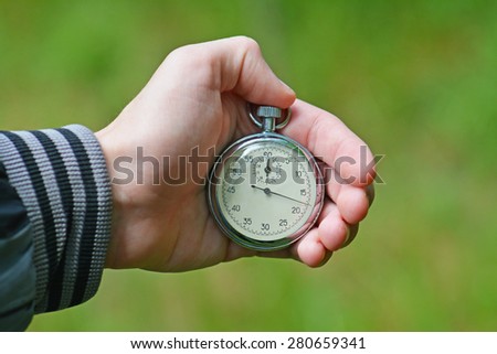 Stop watch in a hand