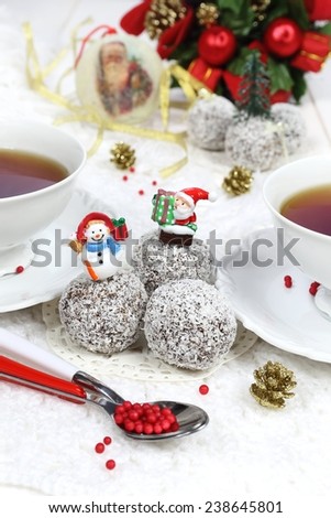 Happy new year: chocolates in coconut flakes in the New Year decoration