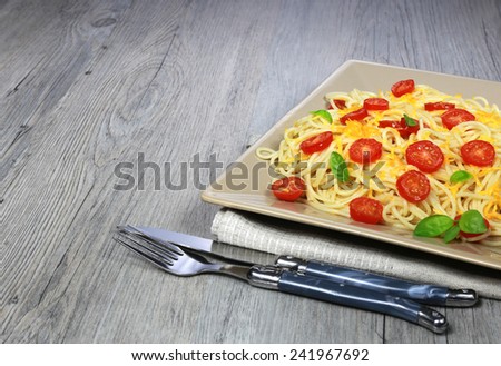 Italian food: Spaghetti with tomato and grated cheese
