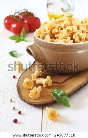 International Food, Ingredients: pasta in a clay pot and tomatoes