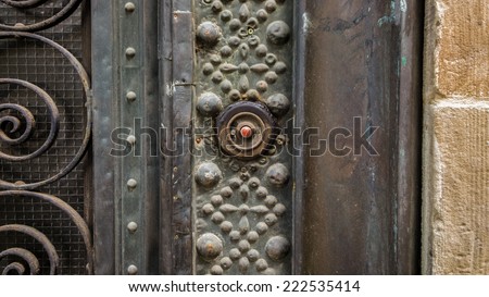 Vintage door bell with metal decoration.
