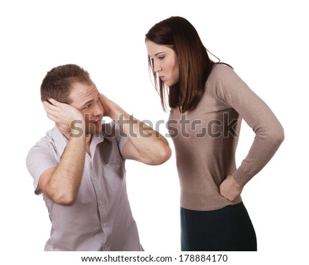 Man shutting his ears and not listening to the persistent yelling of his spouse