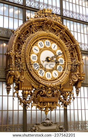 PARIS - AUGUST 21, 2013: Golden clock of the museum D\'Orsay in Paris, France. Musee d\'Orsay has the largest collection of impressionist and post-impressionist paintings in the world.