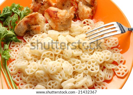 Pasta with meat and parsley on orange plate