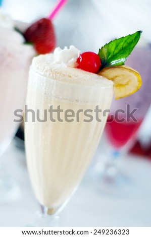 A couple of close ups of some cold fruit milk shakes