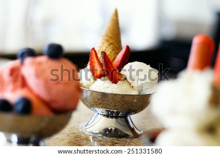 Ice cream cups in a tabletop lit only with natural light