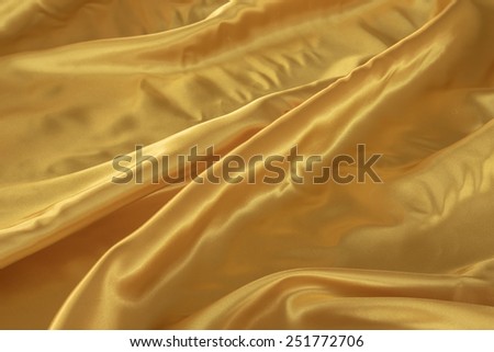 Gold silk fabric background - soft, elegant and delicate