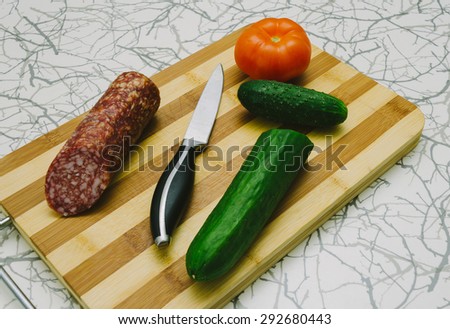Home food with knife on the kitchen table
