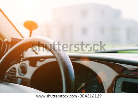 View in car with panel, with soft sunrise in sunset time