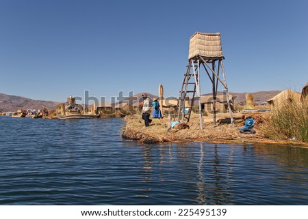 Puno, Bolivia - 27 September 2010: People on one of the Uru floating island on Titicaca lake in Bolivia.