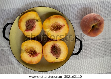 Four halves of peach and whole one