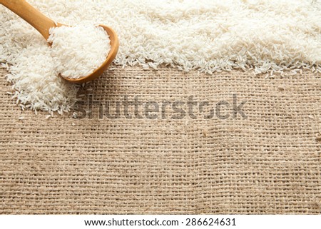 Rice seen from above pouch of jute illuminated with natural light