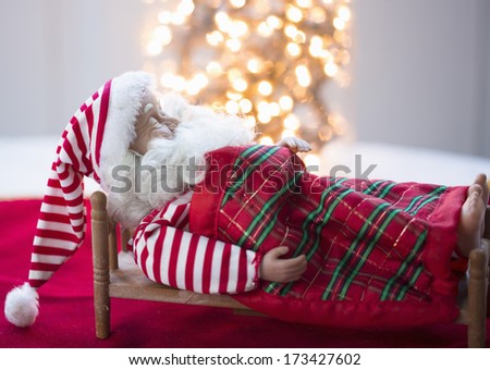 santa claus sleeping in the bad,conceptual, christmas ornament
