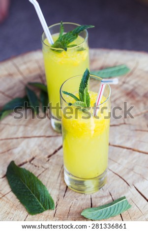 Orange drink on wooden table