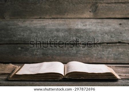 An old book on an old wooden background