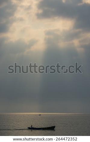 Sunrise Seascape with Fisherman Boat on the Sea in vintage (Soft focus, shallow DOF, slight motion blur)