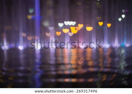 Photo Of love or heart Bokeh Lights in reflection / Street Lights Out Of Focus / filtered heart blurred background