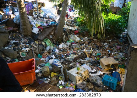 SEMPORNA, MALAYSIA - JUNE 4 2014: Plastic rubbish pollution in home area. Shot showing pollution problem of garbage thrown directly into the sea and home without  proper trash collection or recycling.