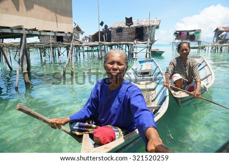 OMADAL ISLAND, SABAH, MALAYSIA - MAY 10 : Unidentified Sea Gypsies people on May 10, 2015 in Sabah, Malaysia. The Sea Gypsies are sea nomads that move from one place to another.