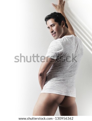 Sexy provocative fashion portrait of young hot naked guy