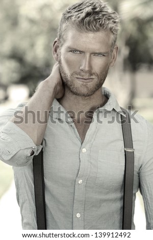 Outdoor Portrait Of A Handsome Young Confident Man