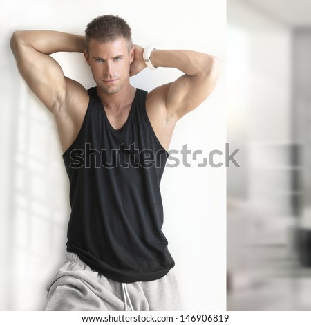 Portrait Of Sexy Muscle Man Posing In Modern Studio