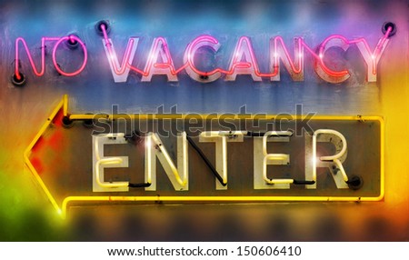 Old retro neon signs reading \'no vacancy\' and \'enter\' in vibrant cool colors
