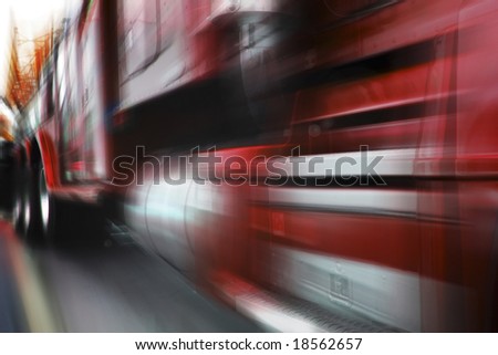 photo of moving red truck with motion blur