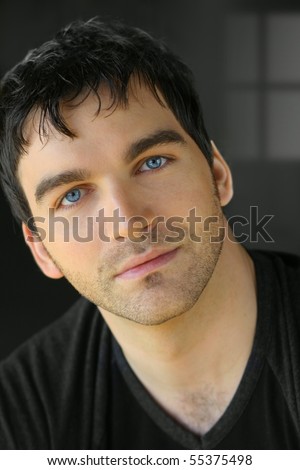 Portrait of a nice young attractive man with blue eyes