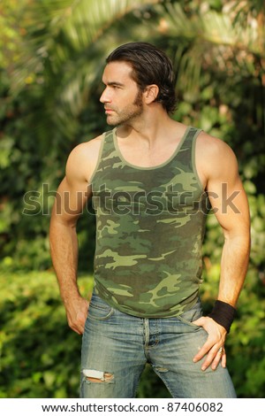 Outdoor natural portrait of a good looking fit guy