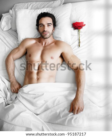 Portrait Of A Sexy Muscular Male Model Waiting In Modern Bed With ...