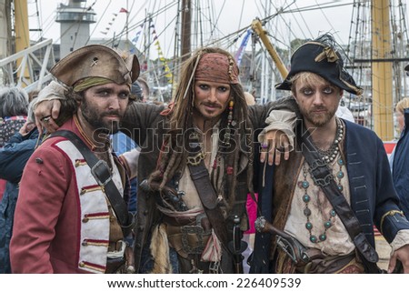 FALMOUTH, CORNWALL, UK - AUGUST 29, 2014 : Pirates including a Jack Sparrow look-a-like (from the Pirates of the Caribbean films) at Falmouth Tall Ships Regatta 2014.