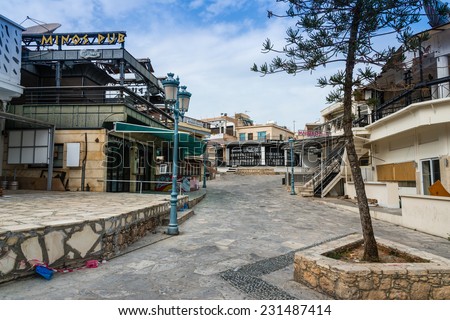 AYIA NAPA, CYPRUS - MARCH 16, 2014 : Streets of Ayia Napa showing the bars and nightclubs off season and deserted of people.